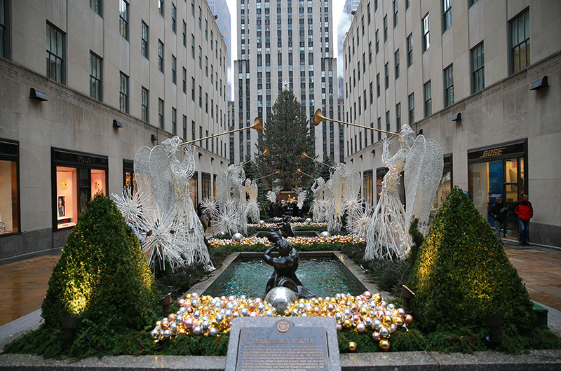 Angels hold up trumpets in the Garden at Rockefeller Center. (Gordon Donovan/Yahoo News)