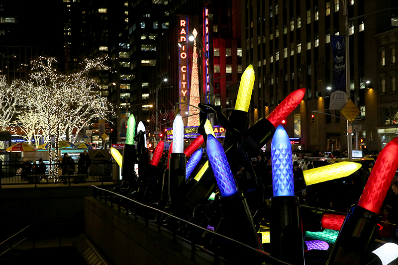 Giant Christmas lights sit along the sidewalk down the street from Radio City Music Hall. (Gordon Donovan/Yahoo News)