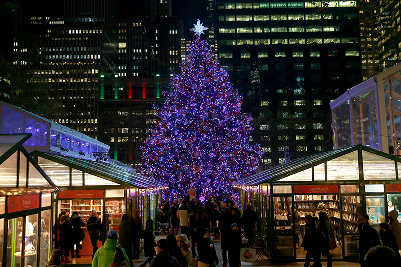 A Christmas tree in stands in the Winter Village in Bryant Park in the heart of New York City. (Gordon Donovan/Yahoo News)