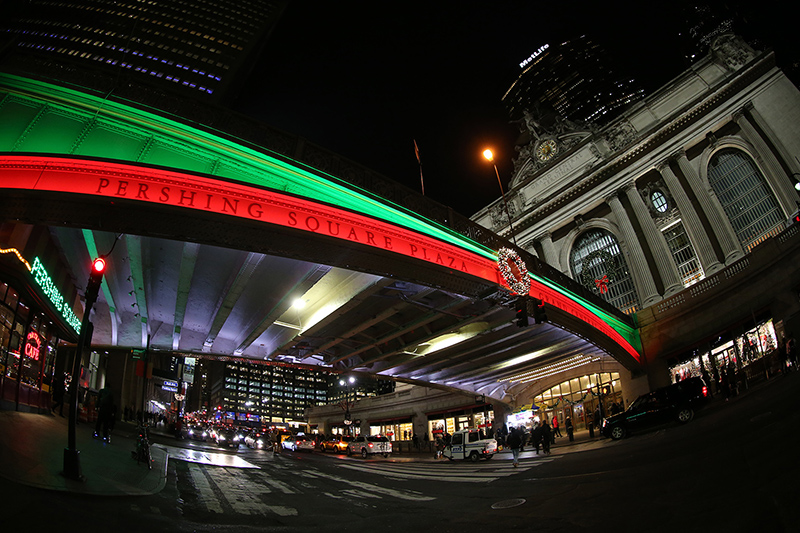 Colored lights illuminate along the bridge above E. 42nd Street at Pershing Square Plaza across from Grand Central Terminal in New York City. (Gordon Donovan/Yahoo News)