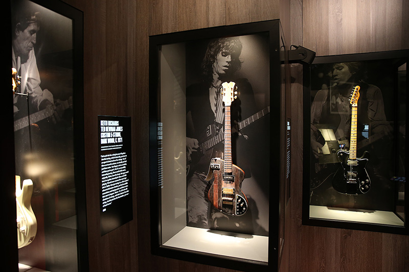 Keith Richards' Ted Newman Jones Custom 5-String Dark Wood, C. 1971 and Keith Richards 1972 Fender Telecaster on display in the Guitar Gallery of The Rolling Stones Exhibitionism. (Gordon Donovan/Yahoo News)