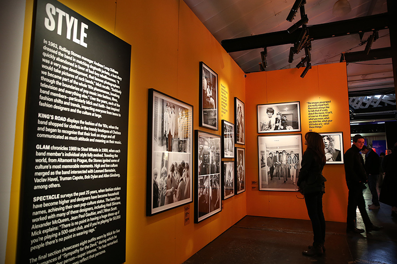 Visitors to the Rolling Stones' "Exhibitionism" check out the rare photos from the style gallery. (Gordon Donovan/Yahoo News)