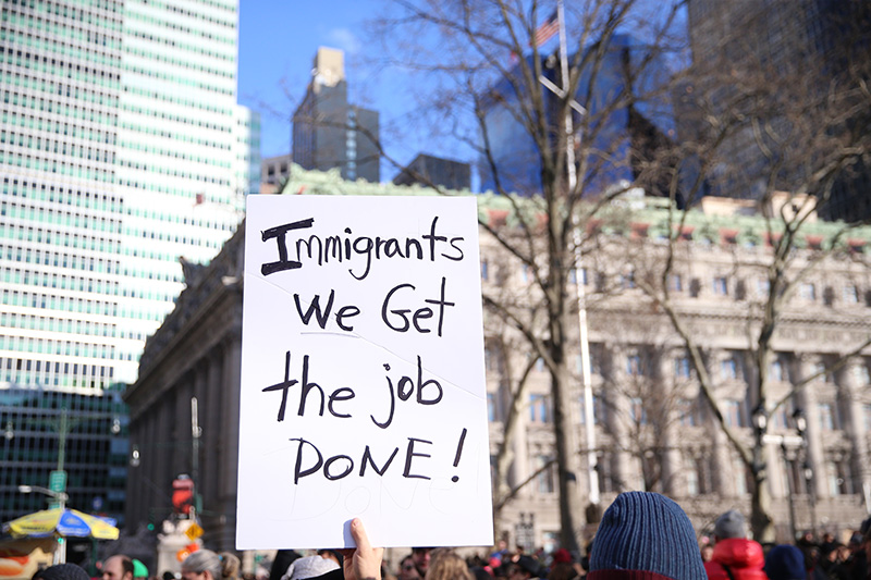 Protesters and immigrants' rights' advocates rally in opposition to President Donald Trump's immigration order as it sowed more chaos and outrage across the country, Jan. 29, 2017, at Battery Park in New York. (Gordon Donovan/Yahoo News)