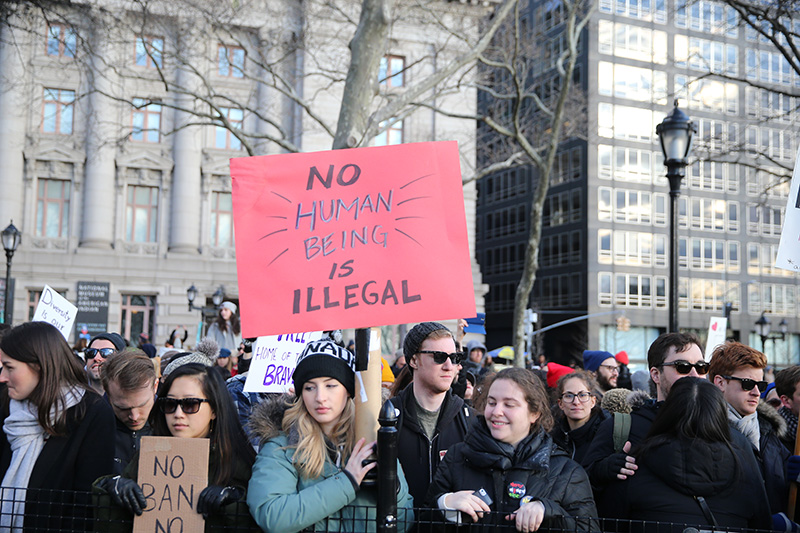 Protesters and immigrants' rights' advocates rally in opposition to President Donald Trump's immigration order as it sowed more chaos and outrage across the country, Jan. 29, 2017, at Battery Park in New York. (Gordon Donovan/Yahoo News)