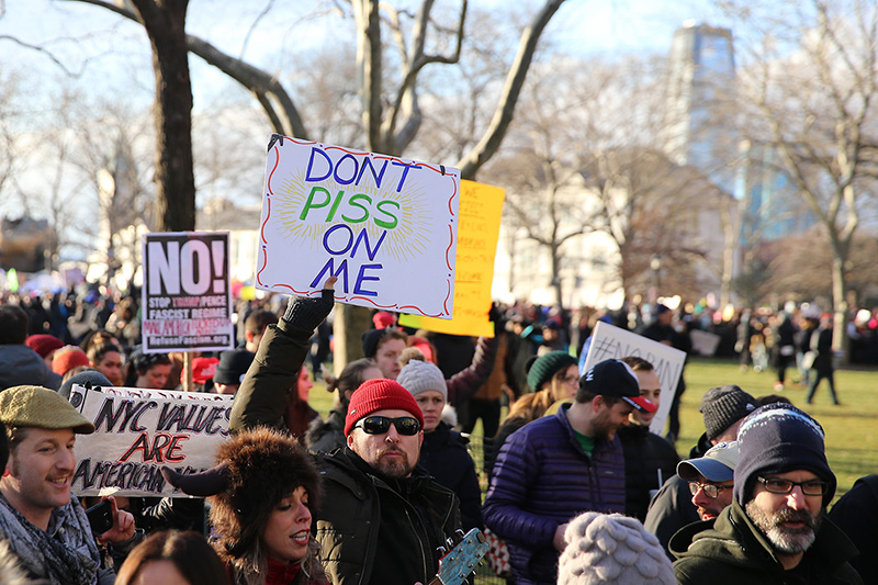 A man holds up a sign during a rally in New York's Battery Park on Jan. 29, 2017, protesting President Donald Trump's immigration order. (Gordon Donovan/Yahoo News)
