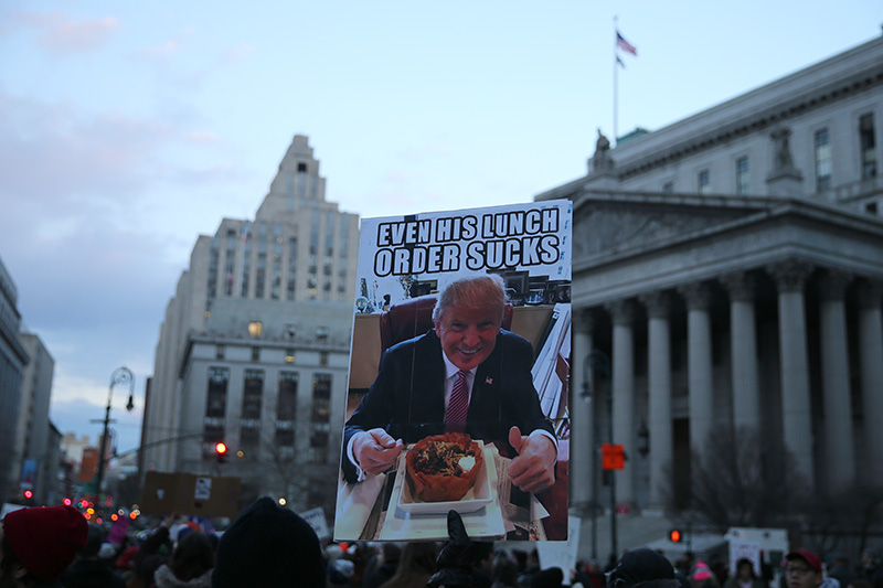 People hold up signs in New York's Foley Square in New York, Jan. 29, 2017, protesting President Donald Trump's immigration order. (Gordon Donovan/Yahoo News)
