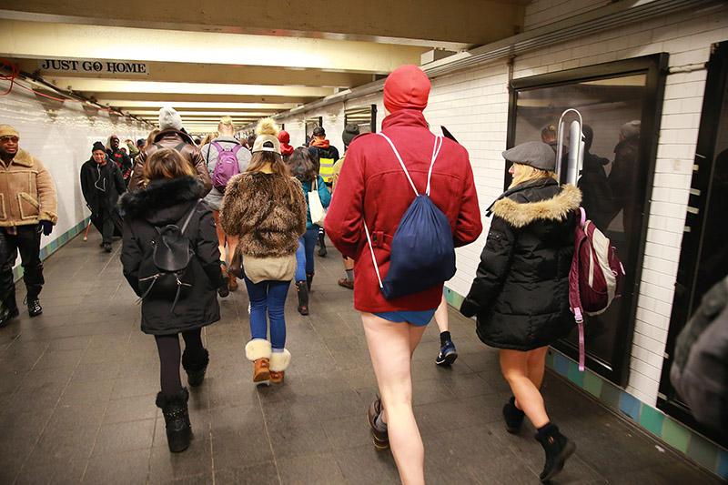 Participants of the No Pants Subway Ride head towards a connecting train in New York City, Sunday, Jan. 8, 2017. The 'No Pants Subway Ride' is an annual event that has become a global celebration of bare thighs. The 'celebration of silliness' is designed to make other subway riders smile. (Gordon Donovan/Yahoo News)