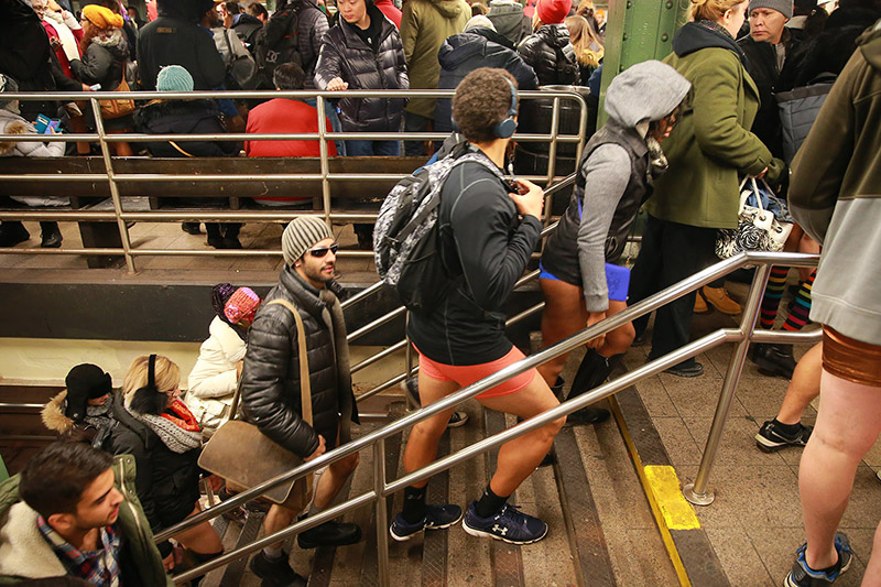 Participants of the No Pants Subway Ride arrive in Union Square Station in New York City, Sunday, Jan. 8, 2017. The 'No Pants Subway Ride' is an annual event that has become a global celebration of bare thighs. The 'celebration of silliness' is designed to make other subway riders smile. (Gordon Donovan/Yahoo News)