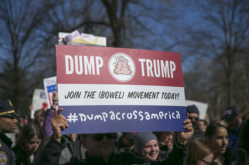 A demonstrator holds up a "Dump Trump" sign during the "Not My President's Day" rally on Central Park West in New York City on Feb. 20, 2017. (Gordon Donovan/Yahoo News)