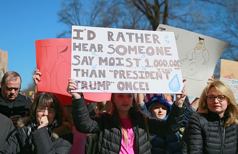A demonstrator holds up a sign during the “Not My President’s Day” rally on Central Park West in New York City on Feb. 20, 2017. (Gordon Donovan/Yahoo News)