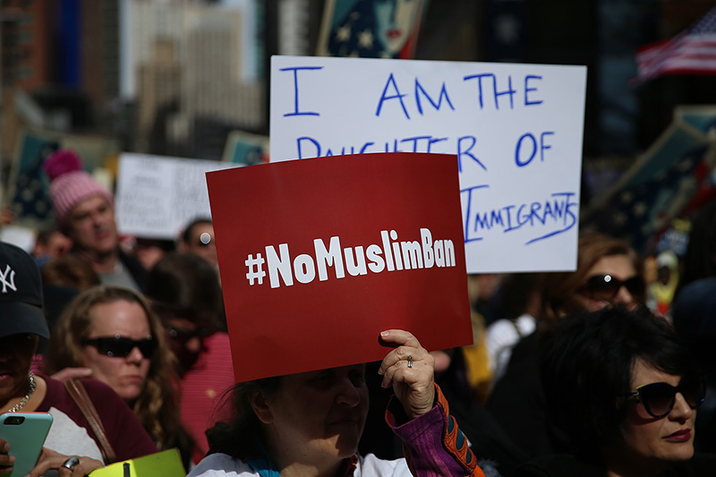 A protester holds up #NoMuslimBan sign at the “I am a Muslim too" rally at Times Square in New York City on Feb. 19, 2017. (Gordon Donovan/Yahoo News)