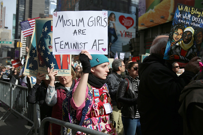 A young woman holds up a sign showing support at the “I am a Muslim too" rally at Times Square in New York City on Feb. 19, 2017. (Gordon Donovan/Yahoo News)