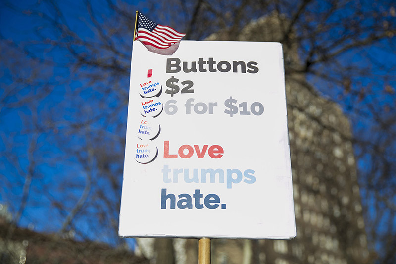Buttons for sale at a rally in front of the Stonewall Inn in solidarity with immigrants, asylum seekers, refugees, and the LGBT community, Feb. 4, 2017 in New York. (Photo: Gordon Donovan/Yahoo News)