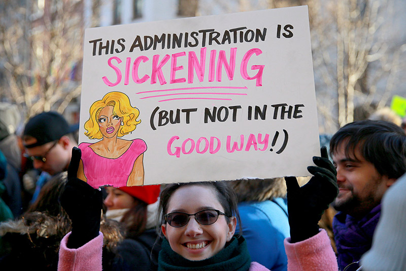 A woman holds up a sign at a rally in solidarity with immigrants, asylum seekers, refugees, and the LGBT community, Feb. 4, 2017 in New York. (Photo: Gordon Donovan/Yahoo News)
