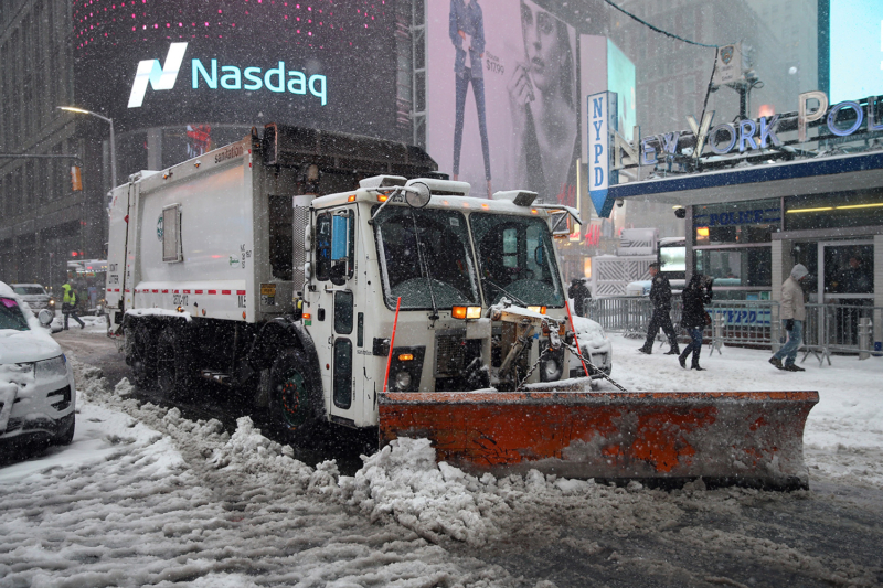 A NYC Sanitation truck plows the streets in Times Square section of New York City on Feb. 9, 2017. (Gordon Donovan/Yahoo News)
