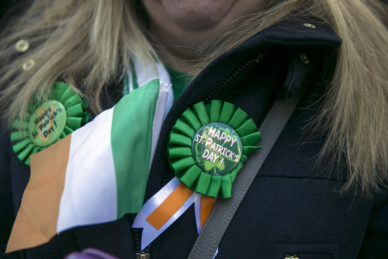A woman wears a ribbon wishing all a Happy St. Patrick's Day in New York City. (Gordon Donovan/Yahoo News)