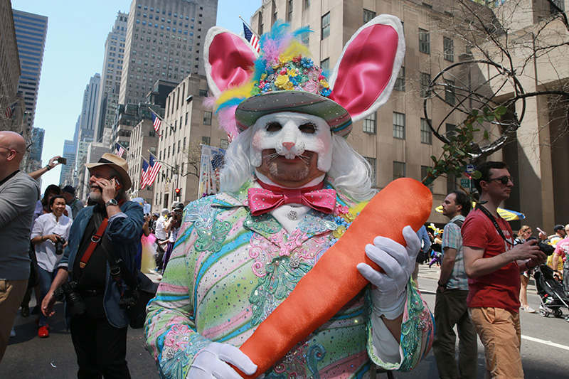 Jesus of Puerto Rico walks softly and carries a big carrot dressed as the Easter bunny during the 2017 New York City Easter Parade on April 16, 2017. (Photo: Gordon Donovan/Yahoo News)