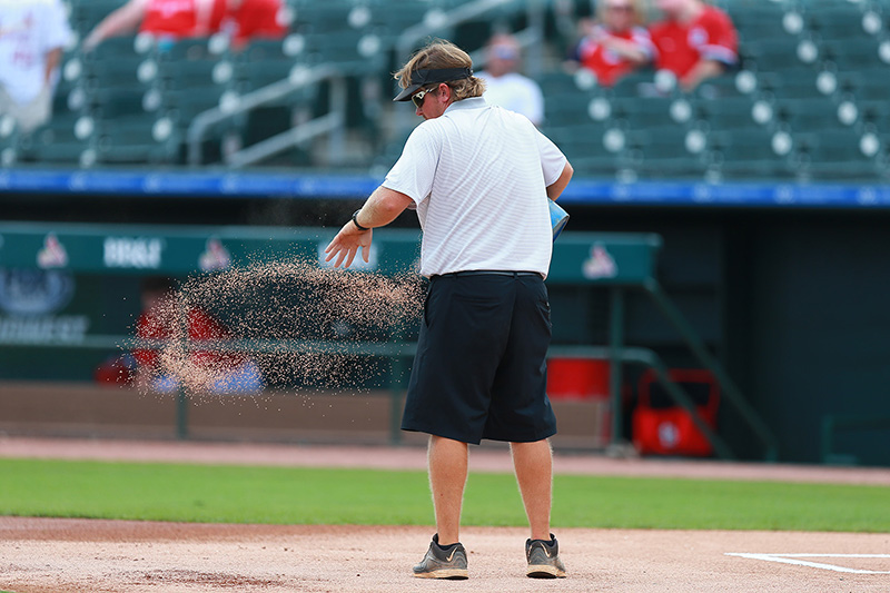 A grounds crew member prepares the field before the spring training baseball game against the New York Mets and St. Louis Cardinals at Roger Dean Stadium in Jupiter, Fl., Wednesday, March 1, 2017. (Gordon Donovan/Yahoo Sports)
